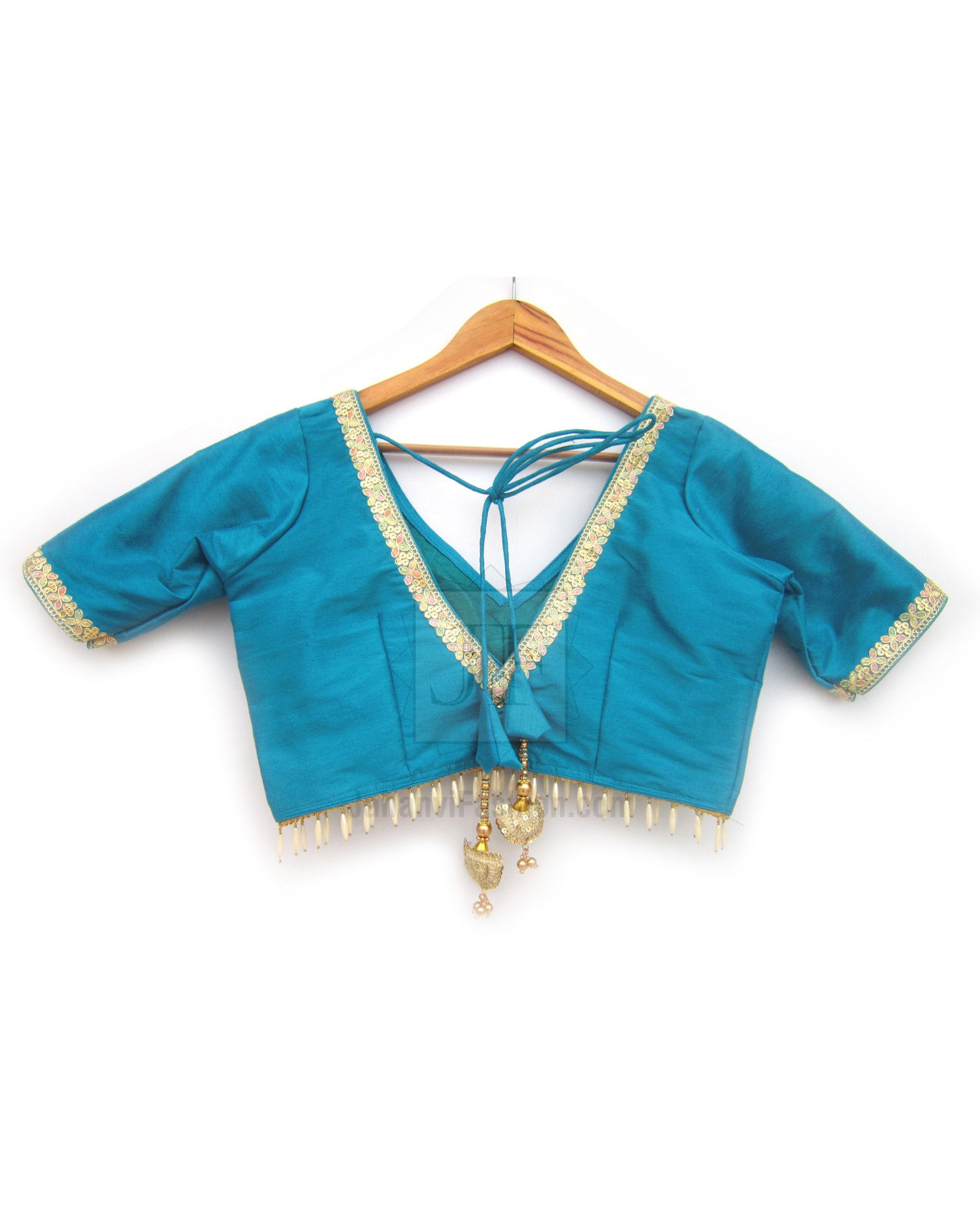 Teal V-neck saree blouse with golden lace trim and tassel fringe hem
