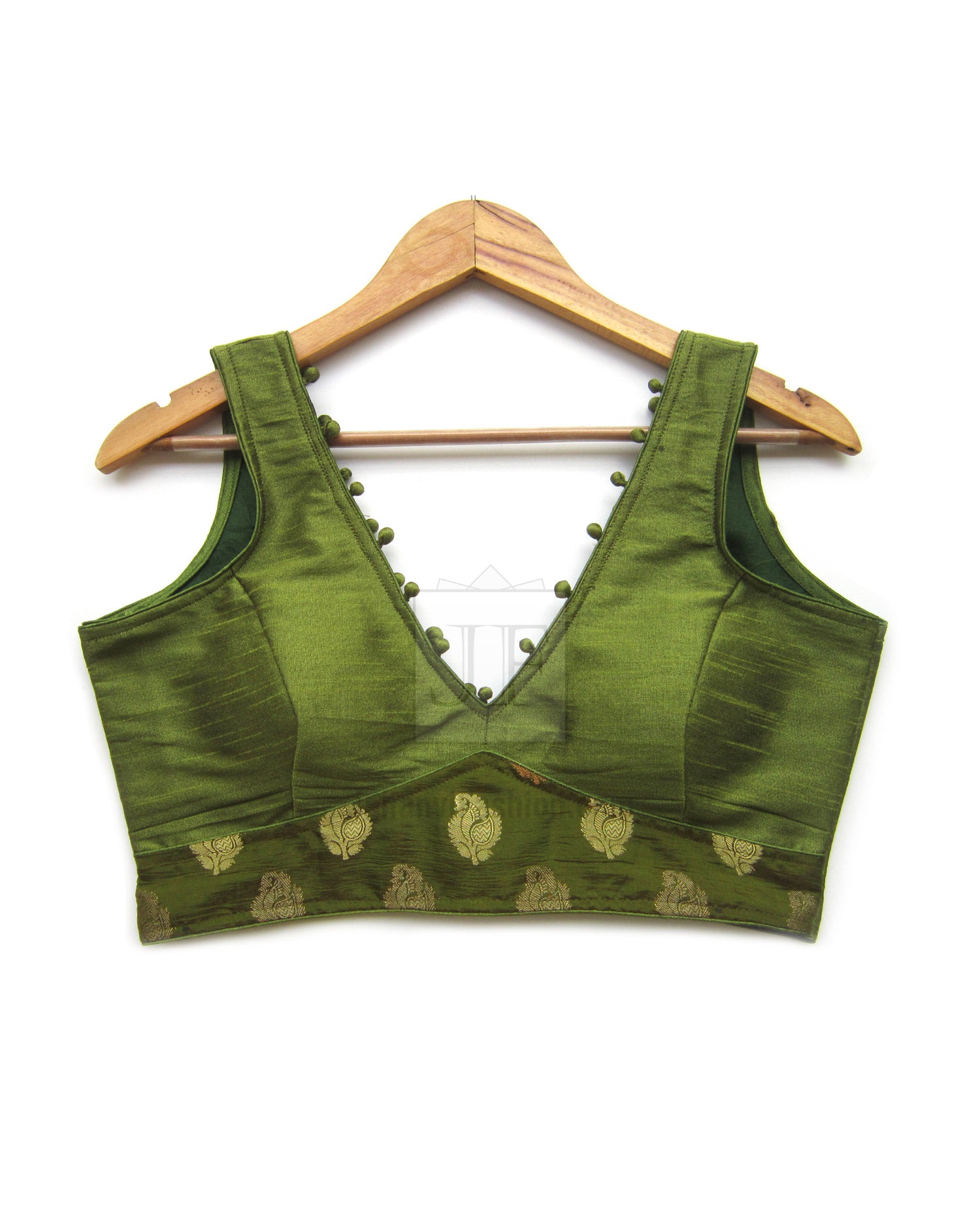 Green V-neck crop saree blouse with beaded trim and embroidered hem panel