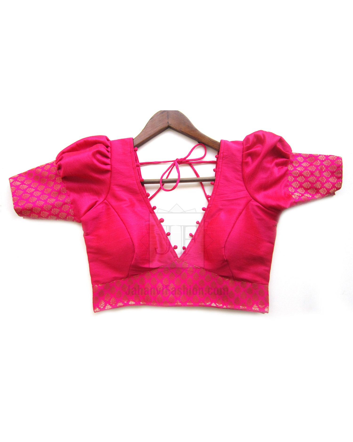 Magenta V-neck saree blouse with patterned hem and lace-up front, short puff sleeves