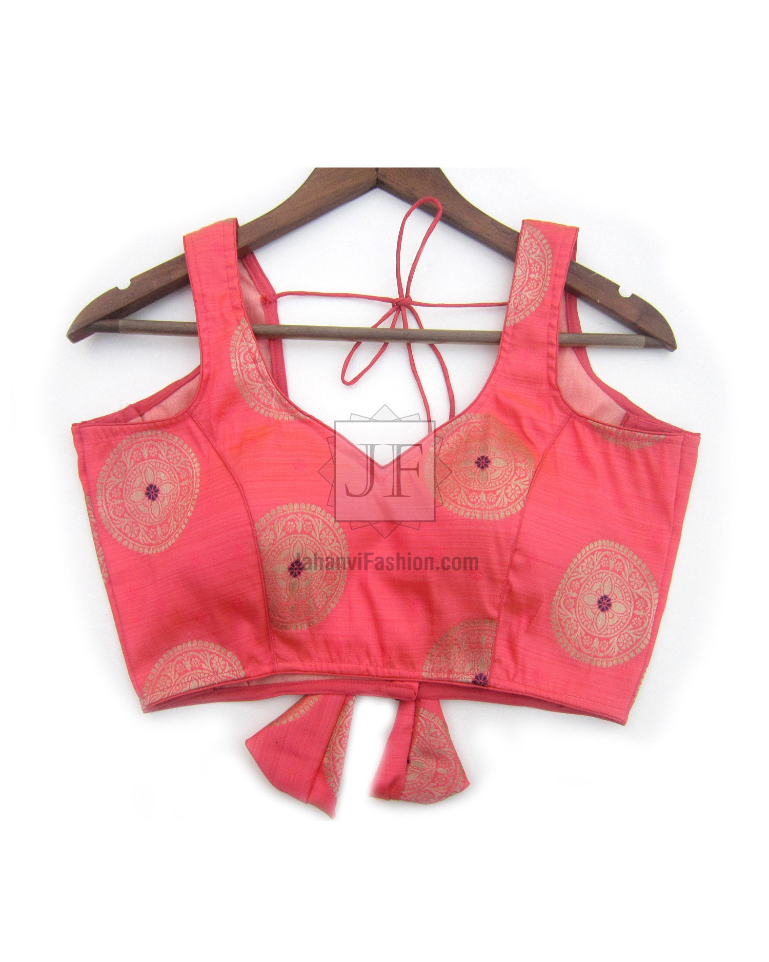 Pink sleeveless saree blouse with sweetheart neckline and back tie, ornate circular brocade