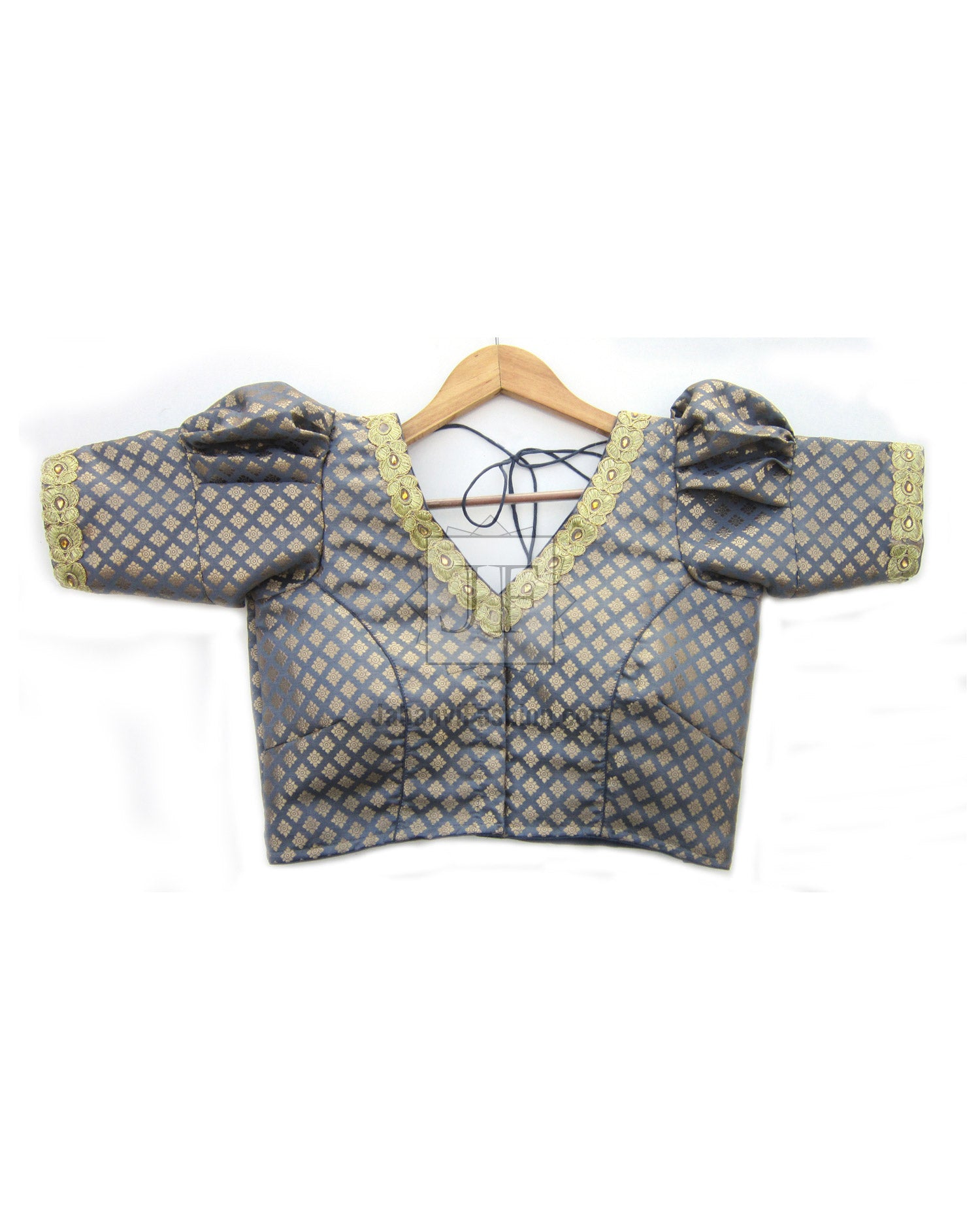Puff sleeve saree blouse in blue patterned fabric with V-neck and dark trim