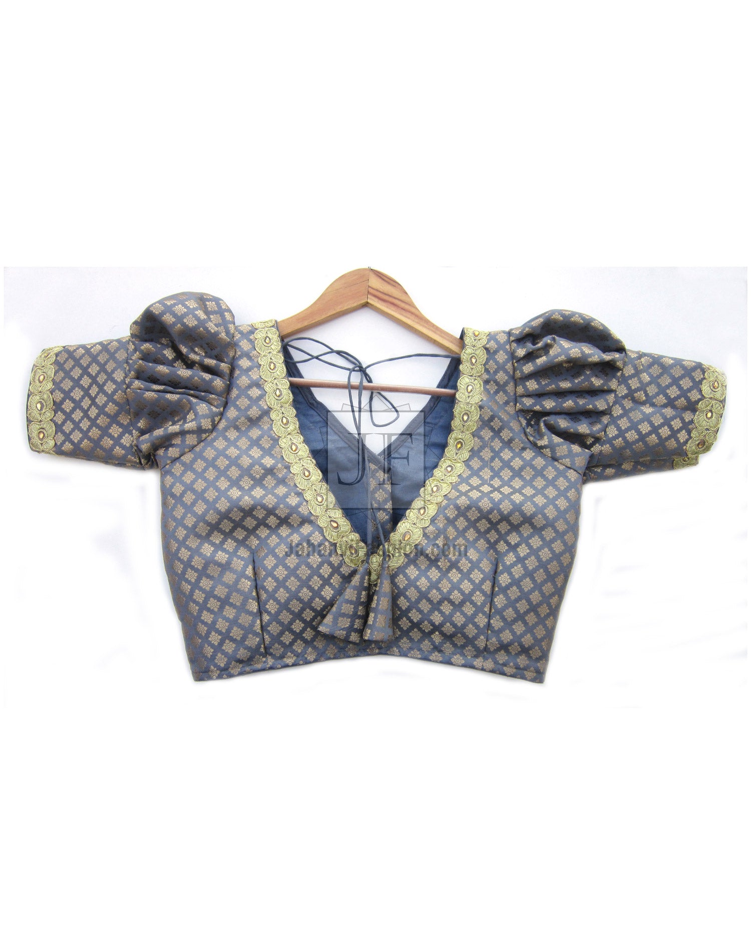 Back view of puff sleeve saree blouse with blue patterned fabric and tie-neck detail