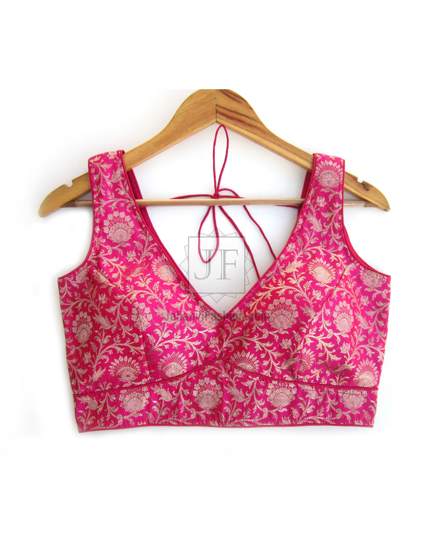 Pink sleeveless V-neck saree blouse with all-over floral print, front view
