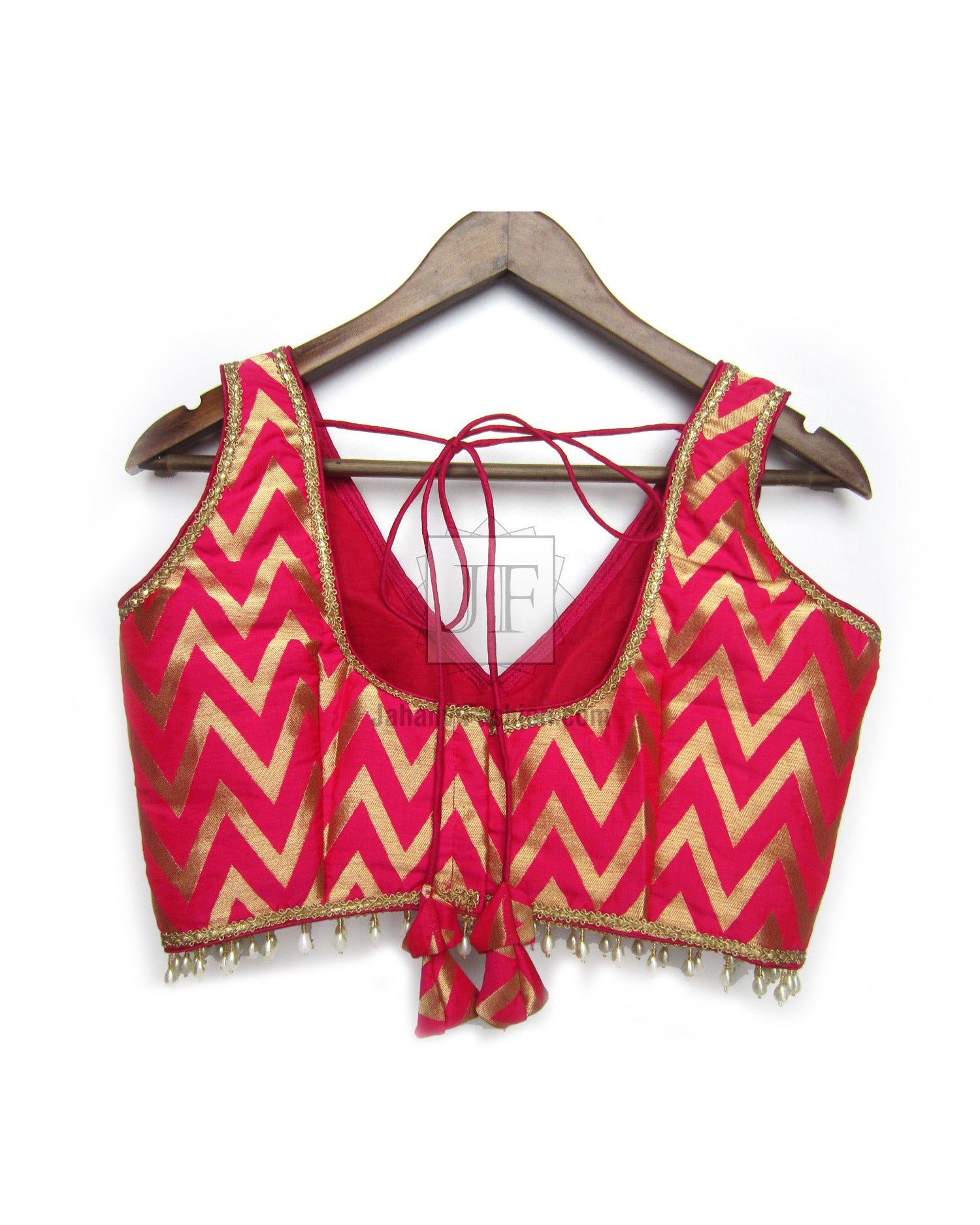 Embroidered zigzag sleeveless crop blouse, deep V-neck, magenta and gold trim, tassel hem