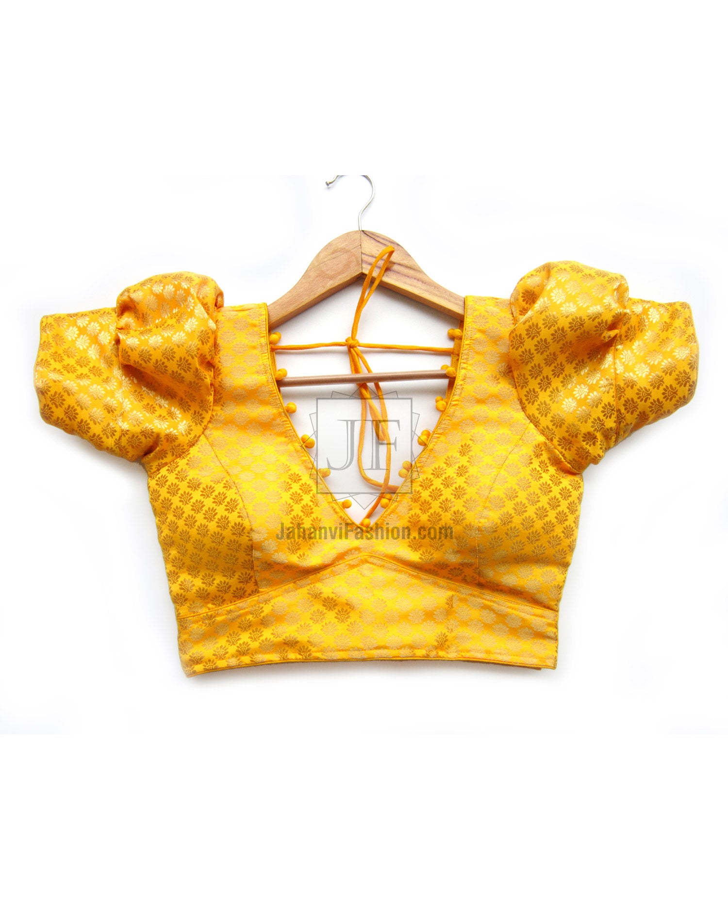 Golden yellow V-neck saree blouse with puff sleeves and lace-up back