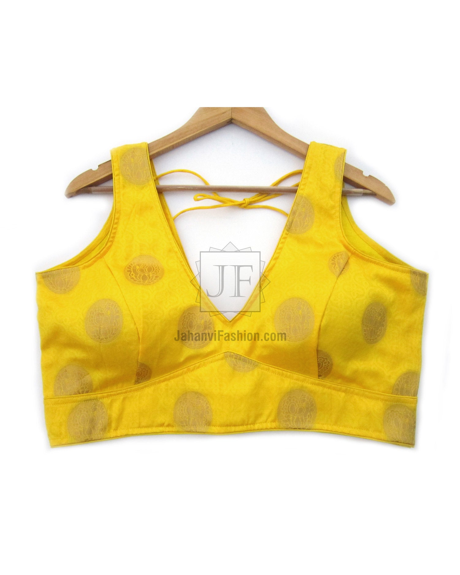 Yellow sleeveless saree blouse with wide straps, V-neck, and tied front