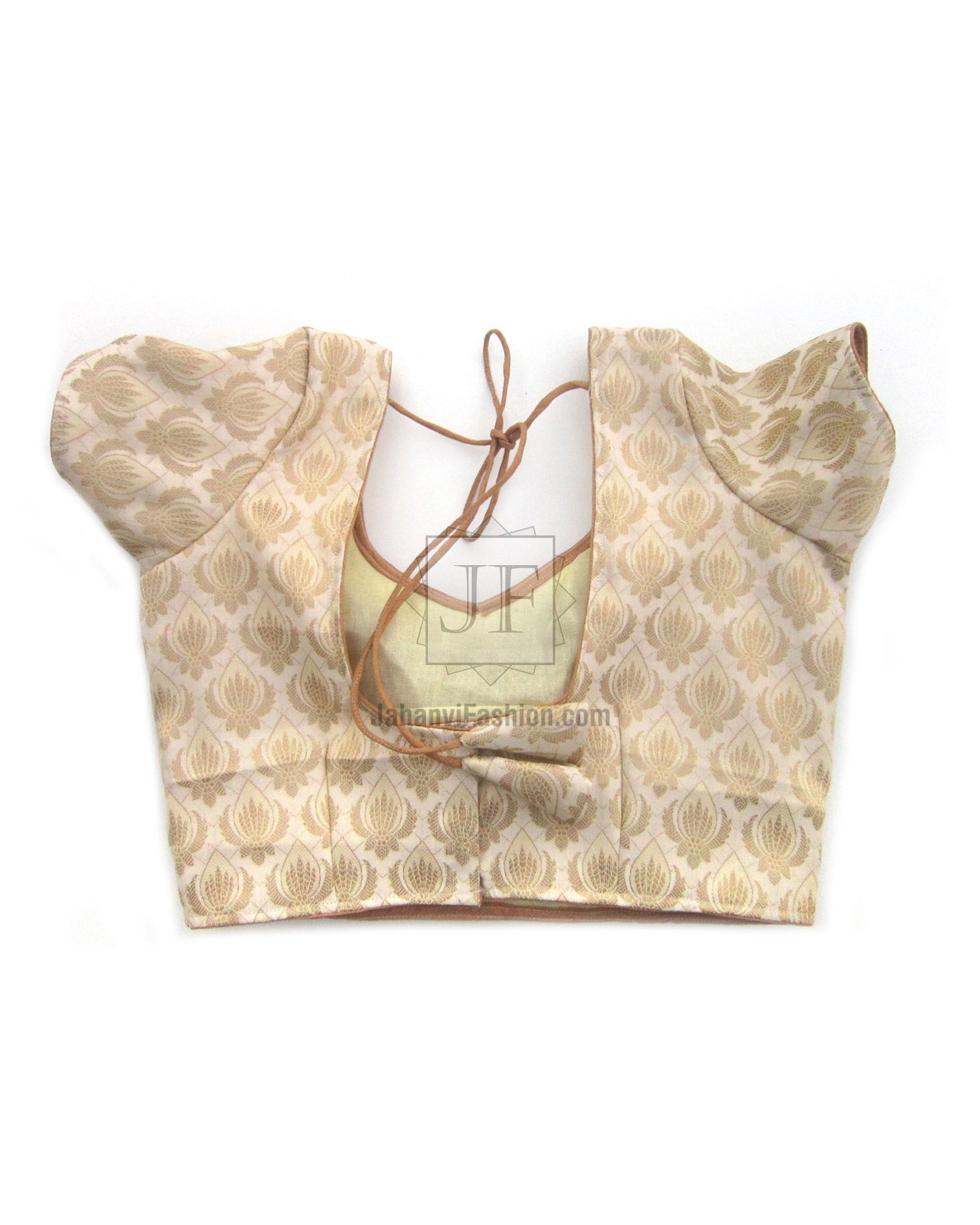 Cream-gold brocade saree blouse with sweetheart neckline and tied-back straps, puff sleeves