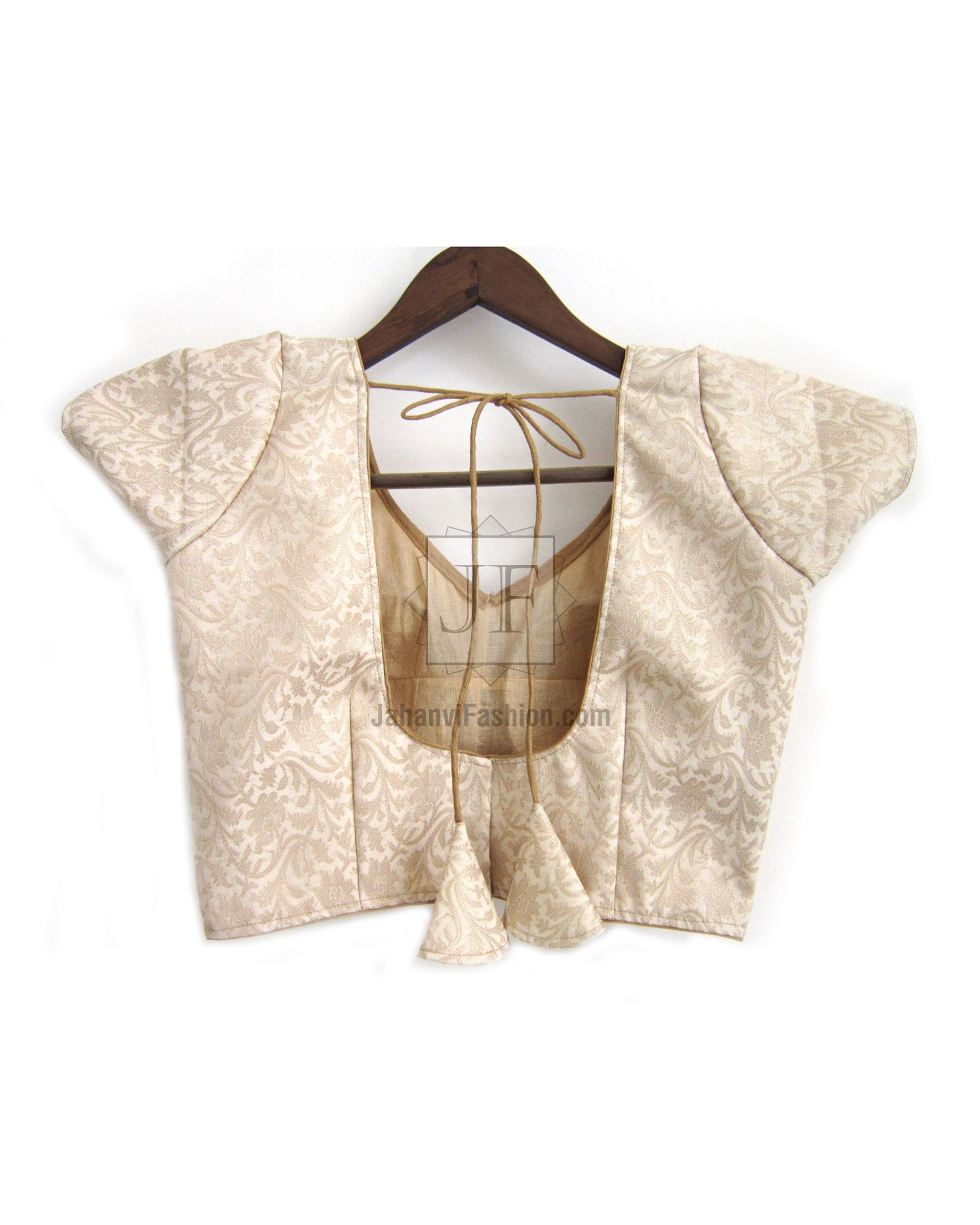 Cream brocade saree blouse with back tie and short puff sleeves, draped back view