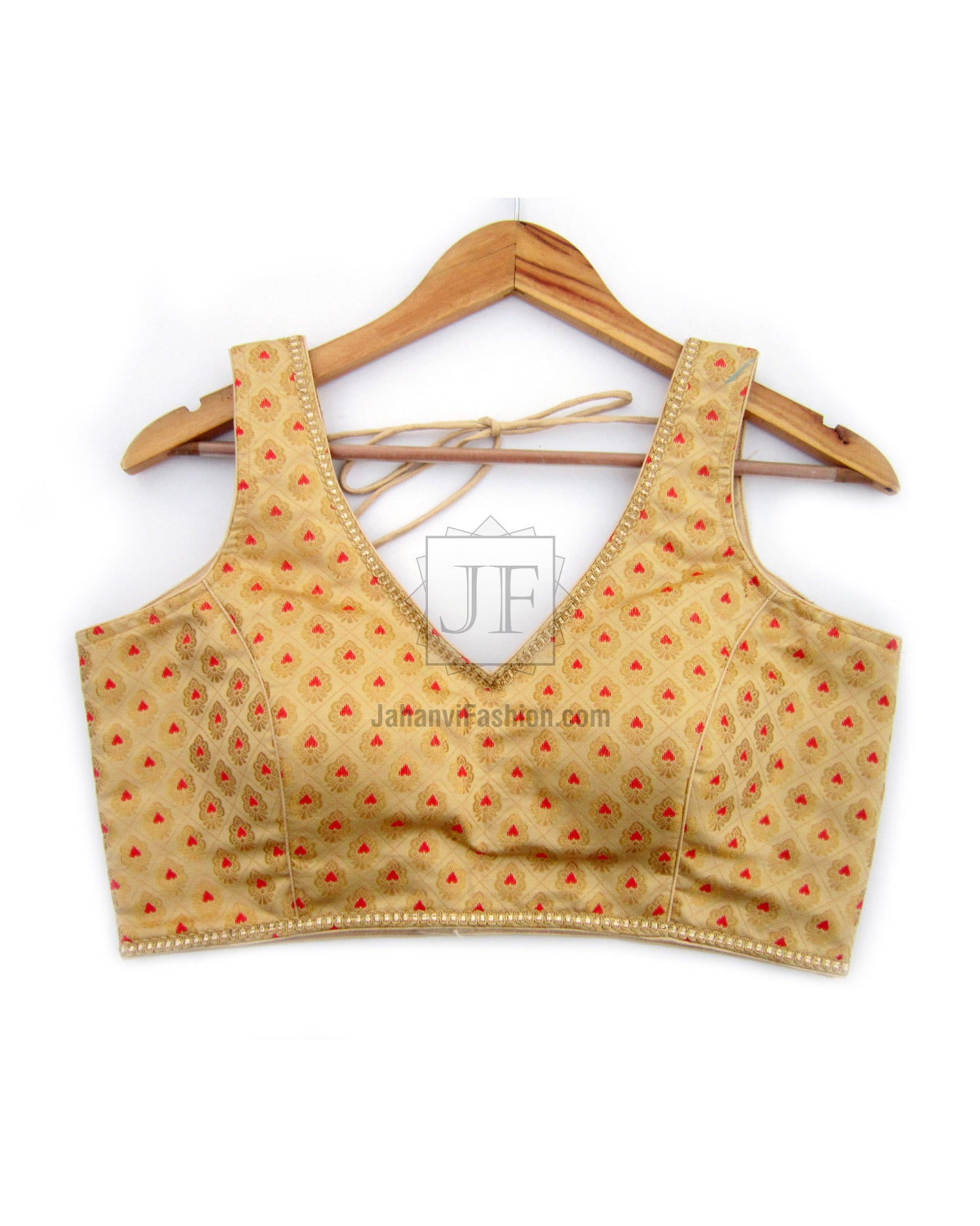 Gold-toned V-neck sleeveless sari blouse with red motif brocade and back tie straps