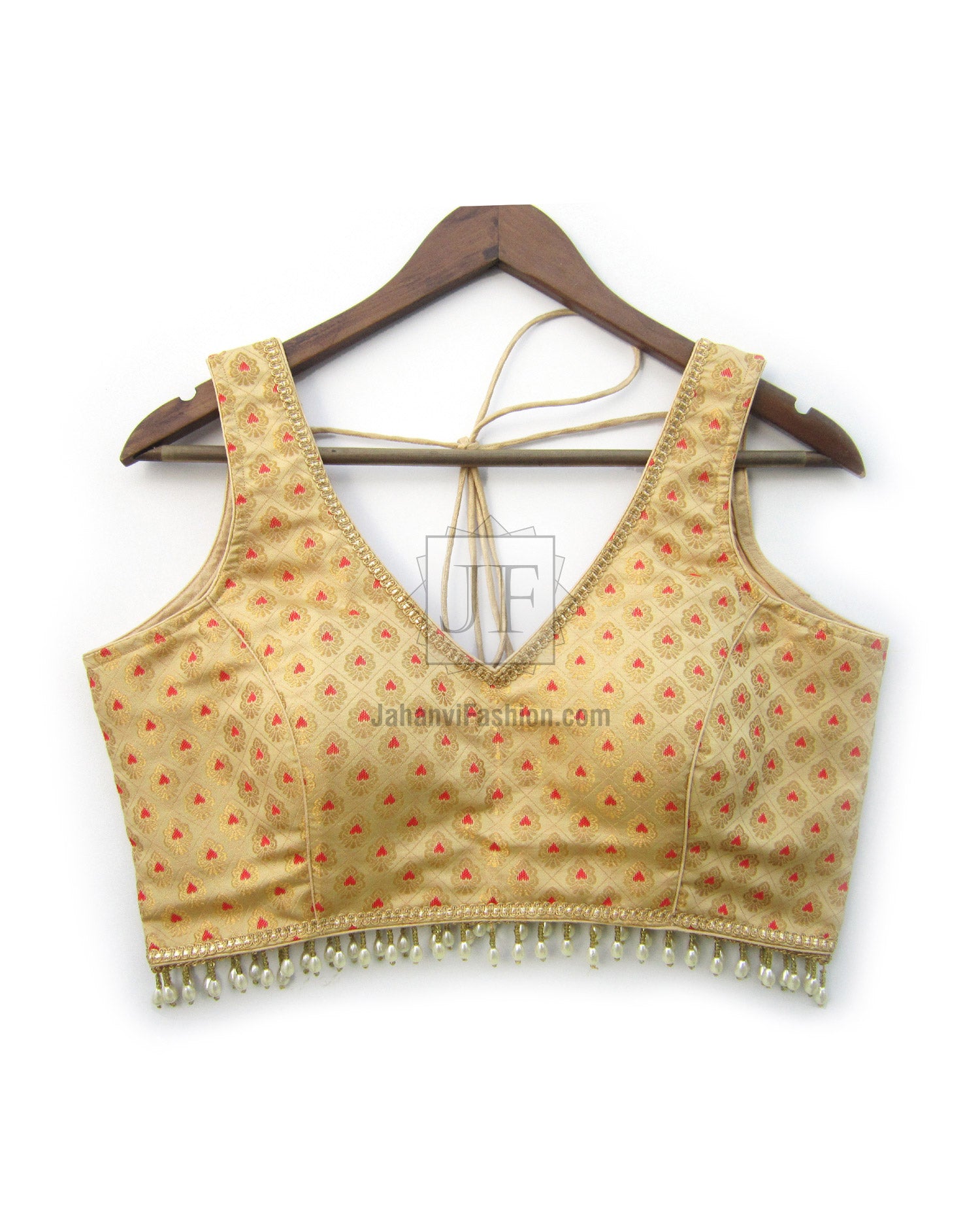 Gold brocade V-neck blouse with all-over red motifs and gold fringe at hem.