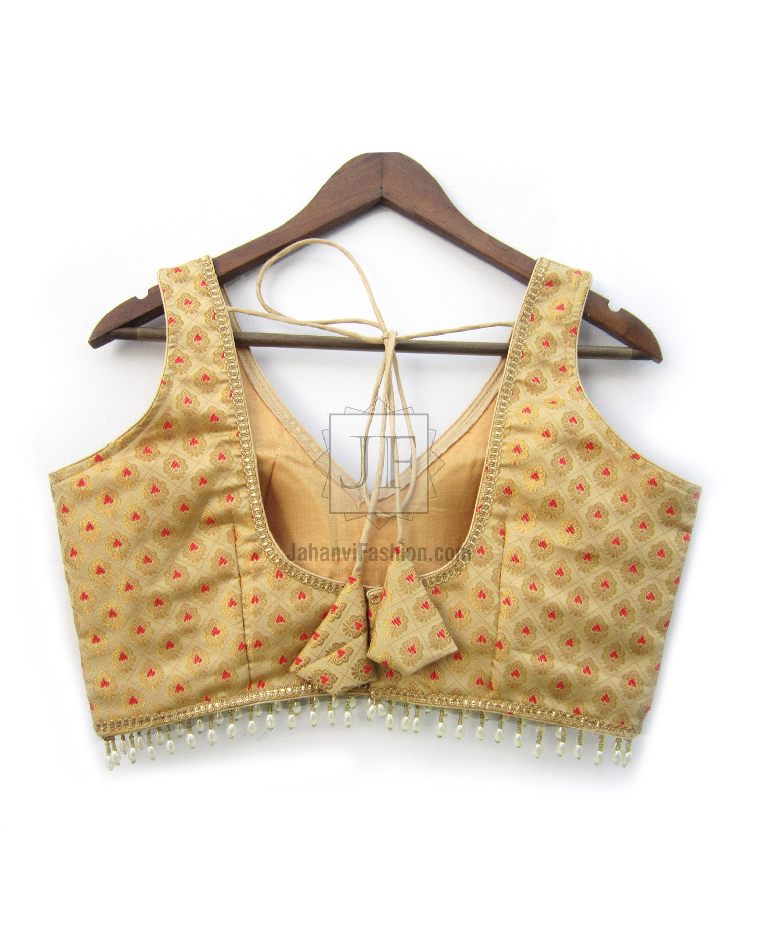 Gold brocade V-neck blouse with tiny red motifs and beaded fringe hem.