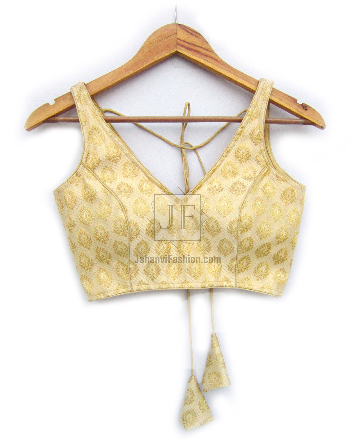 Golden boat-neck saree blouse with allover motif, back ties, and hanging tassels