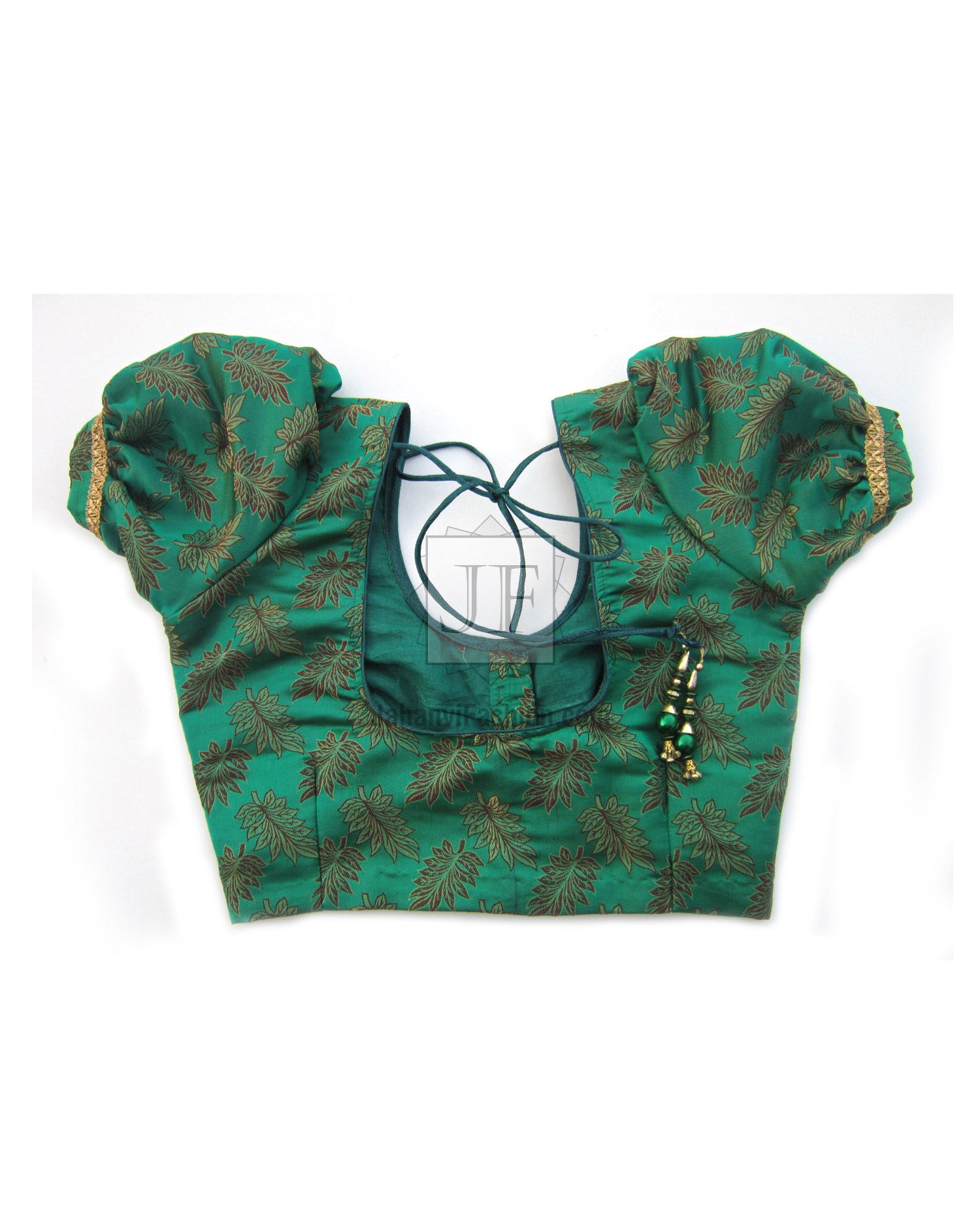 Green saree blouse crop top with puff sleeves, lace-tie neckline and leafy gold pattern.