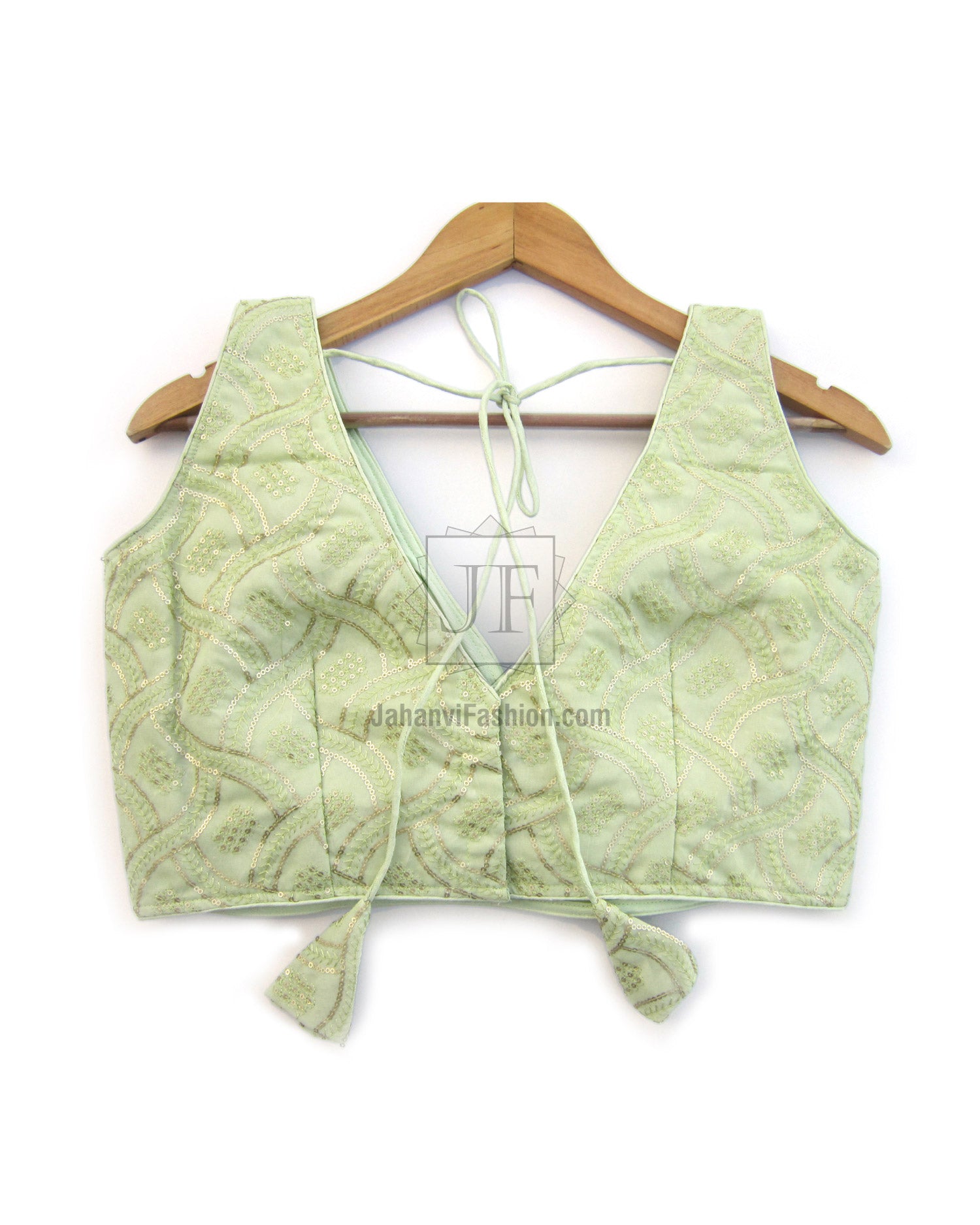 Light green embroidered saree blouse, V-neck sleeveless, tied drawstrings and knot ties