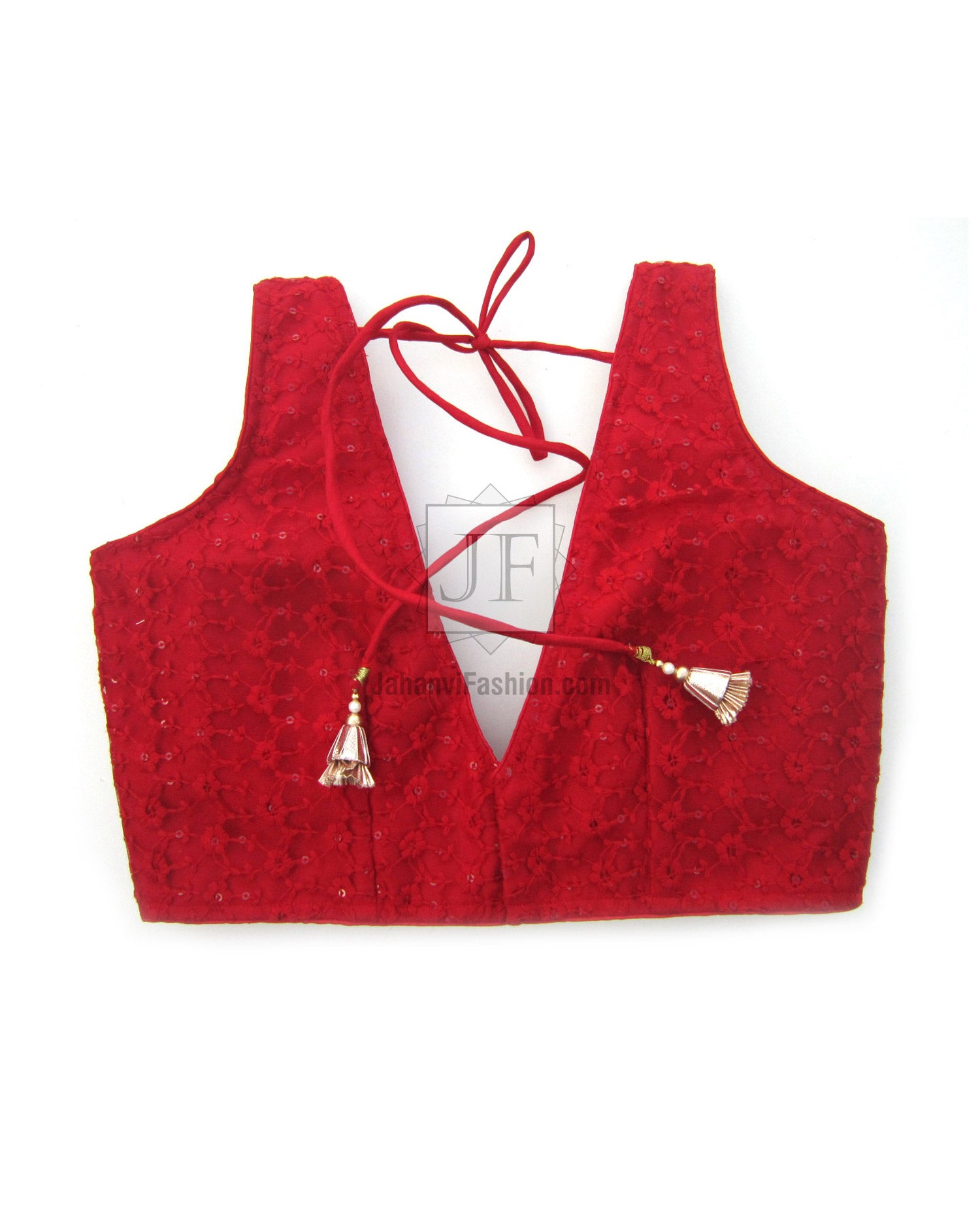 Red saree blouse top with deep V-net embroidery and ribbon tie; tassel accents.