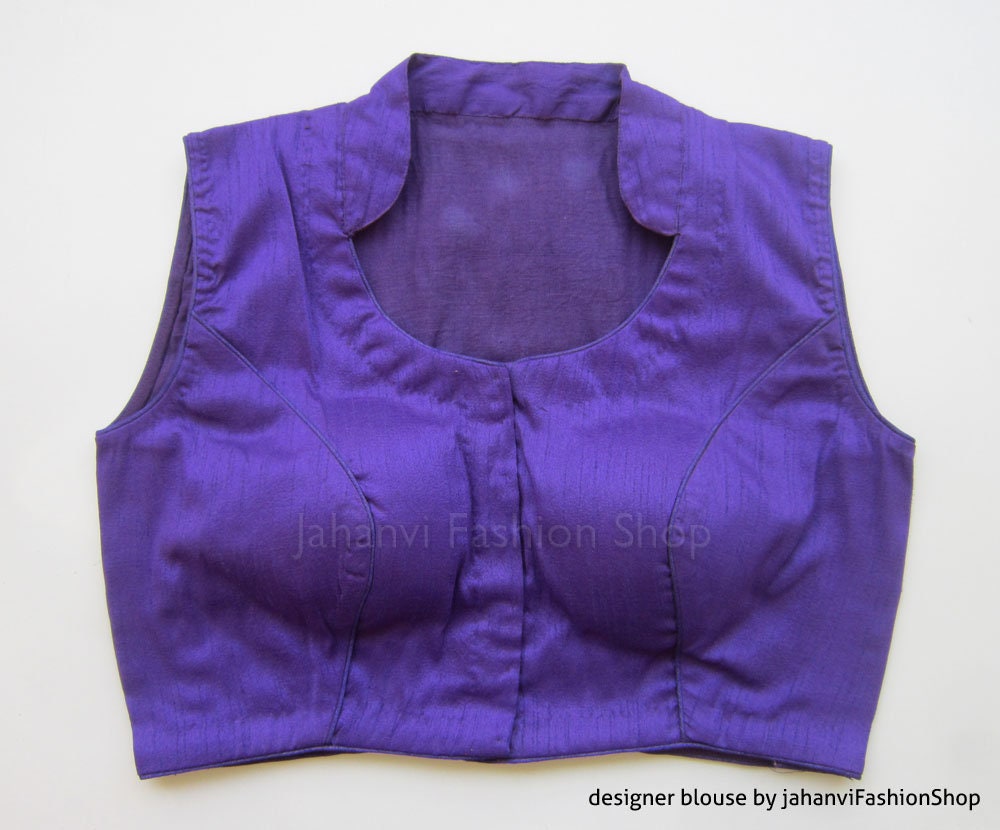 Purple sleeveless blouse with structured collar, front panel, and yoke seams