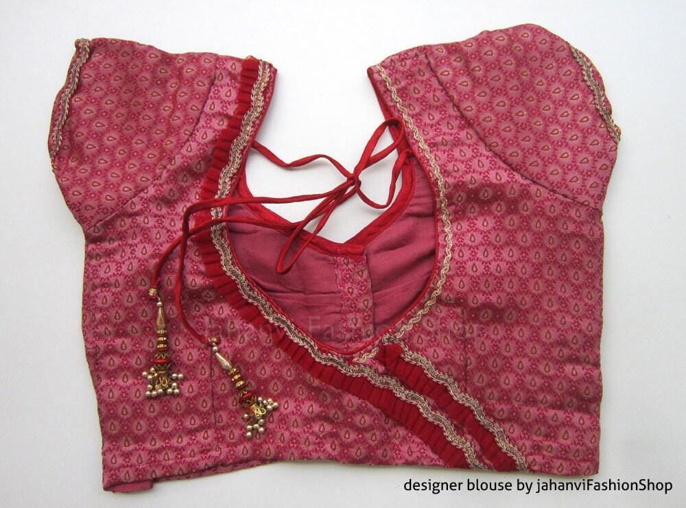 Magenta saree blouse with leaf brocade print, gold trim neckline, crisscross back ties