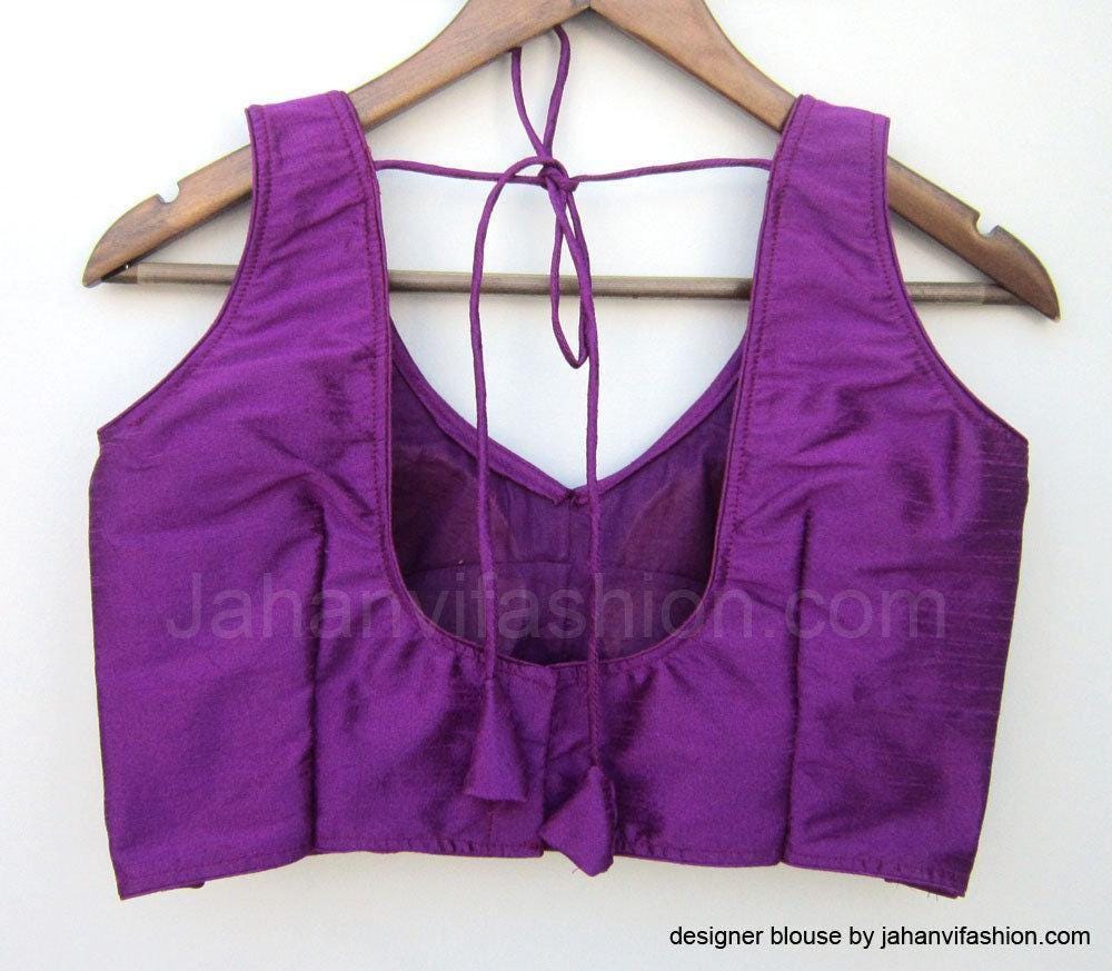 Purple sleeveless saree blouse back view with crisscross neck ties and gathered yoke
