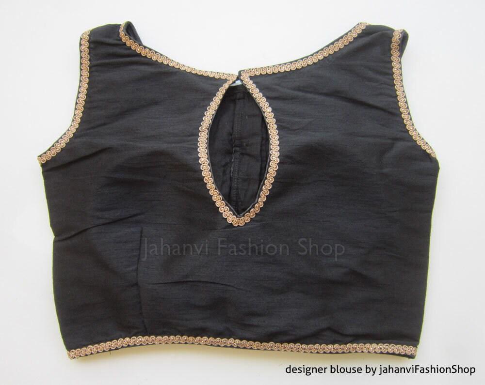Black saree blouse with boat neckline, gold embroidered edging, keyhole tie front