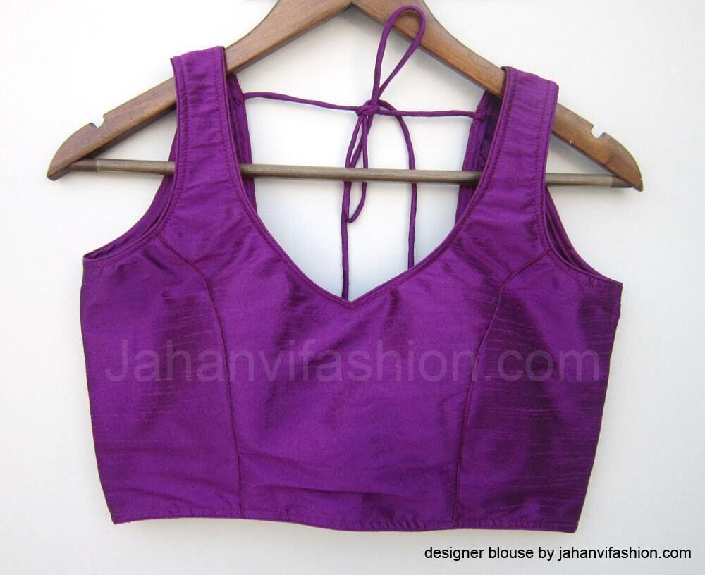 Purple sleeveless saree blouse with sweetheart neckline and center tie-back straps