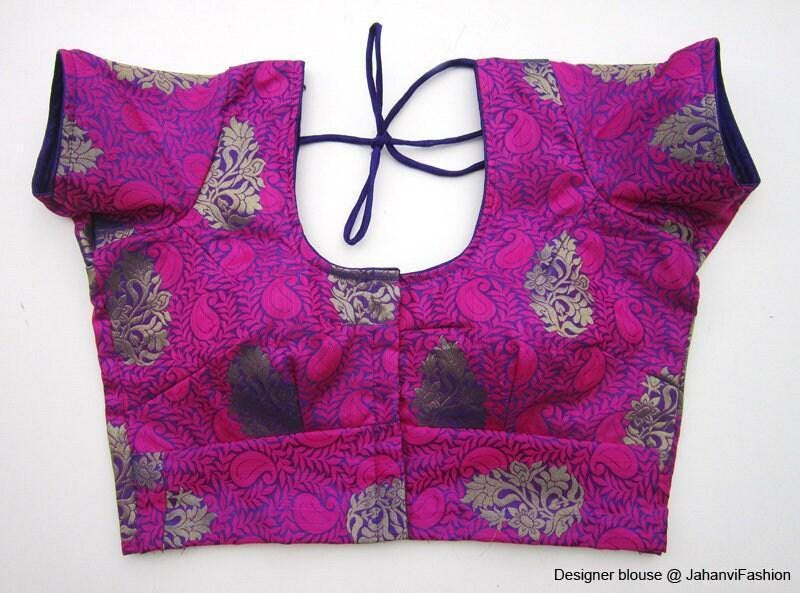 Magenta round-neck crop blouse with short sleeves and back tie; ornate brocade pattern