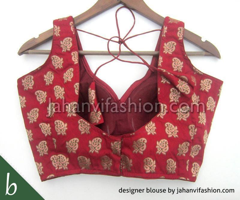 Maroon brocade sleeveless saree blouse with gold motifs and crisscross back tie