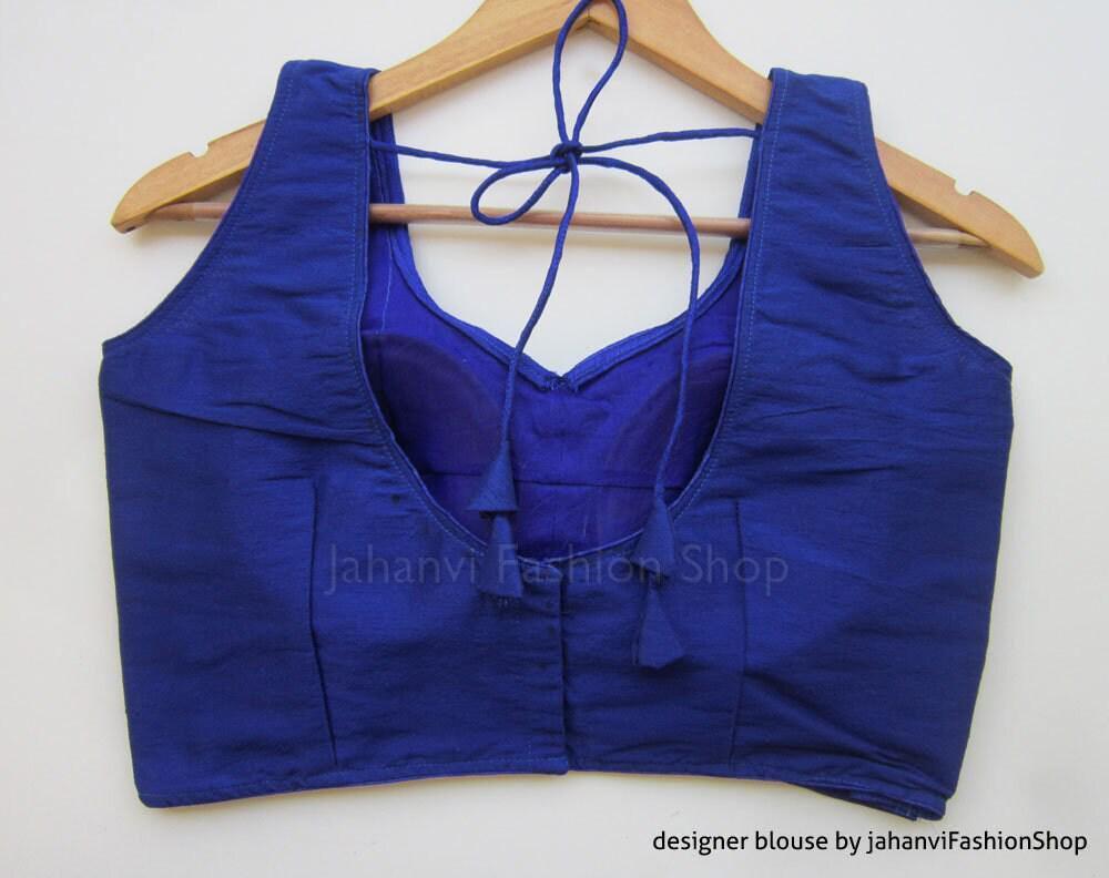 Royal blue sleeveless blouse with sweetheart neckline and tie-back straps