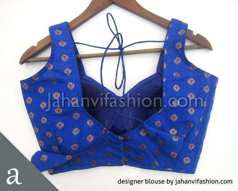 Blue sleeveless saree blouse with sweetheart neckline, tie-back, and small floral pattern