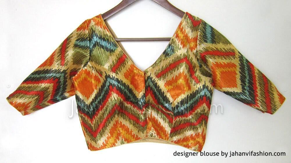 V-neck cropped blouse with multicolor chevron print and long sleeves