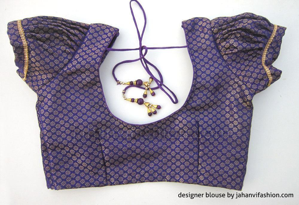 Dark blue brocade blouse with puff sleeves, gold trim, round neckline tie laces