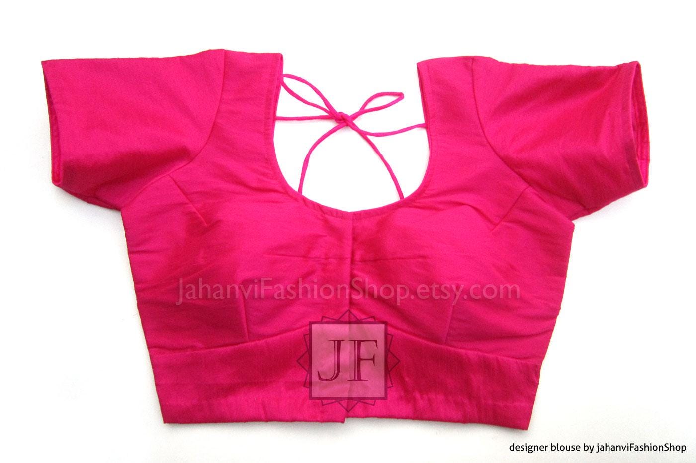 Round-neck saree blouse in bright magenta pink, short sleeves, tie-back neckline