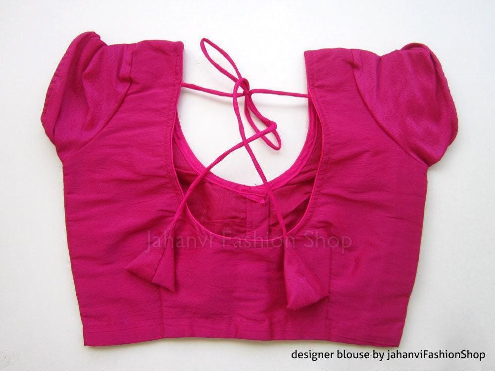 Magenta saree blouse with puff sleeves and crisscross lace-up V neckline