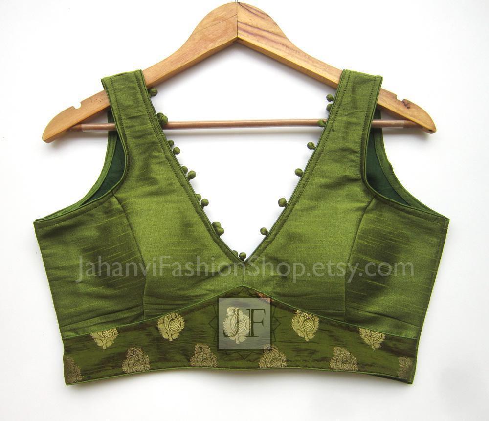 Green v-neck saree blouse crop top with embroidered border and pom-pom trim