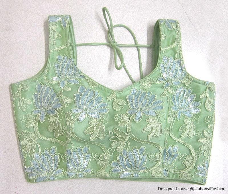 Mint green embroidered saree blouse with sweetheart neckline and 3/4 sleeves