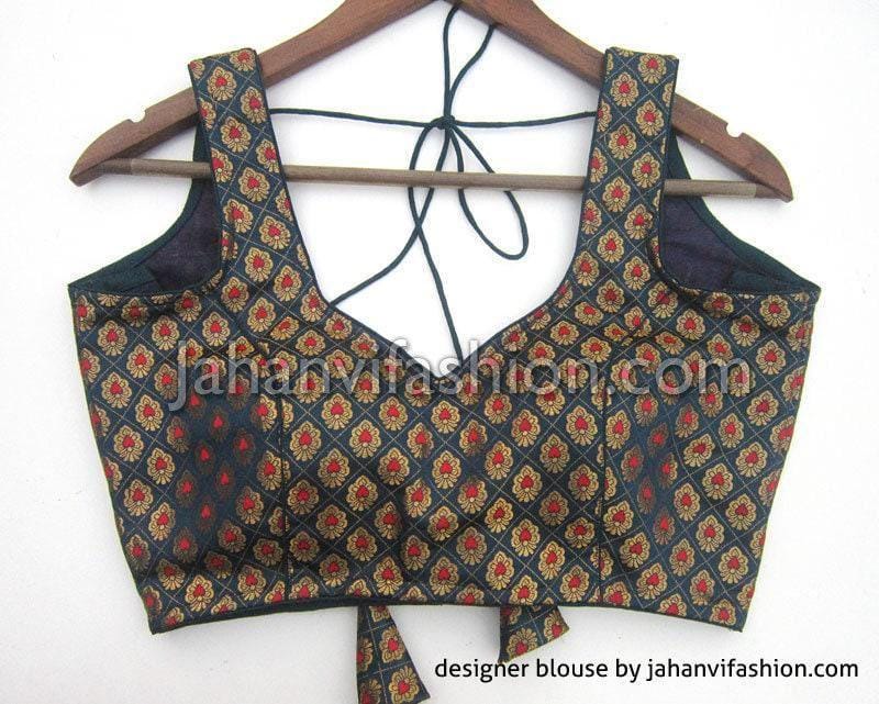 Sleeveless brocade blouse with sweetheart neckline and decorative strings, dark teal floral pattern