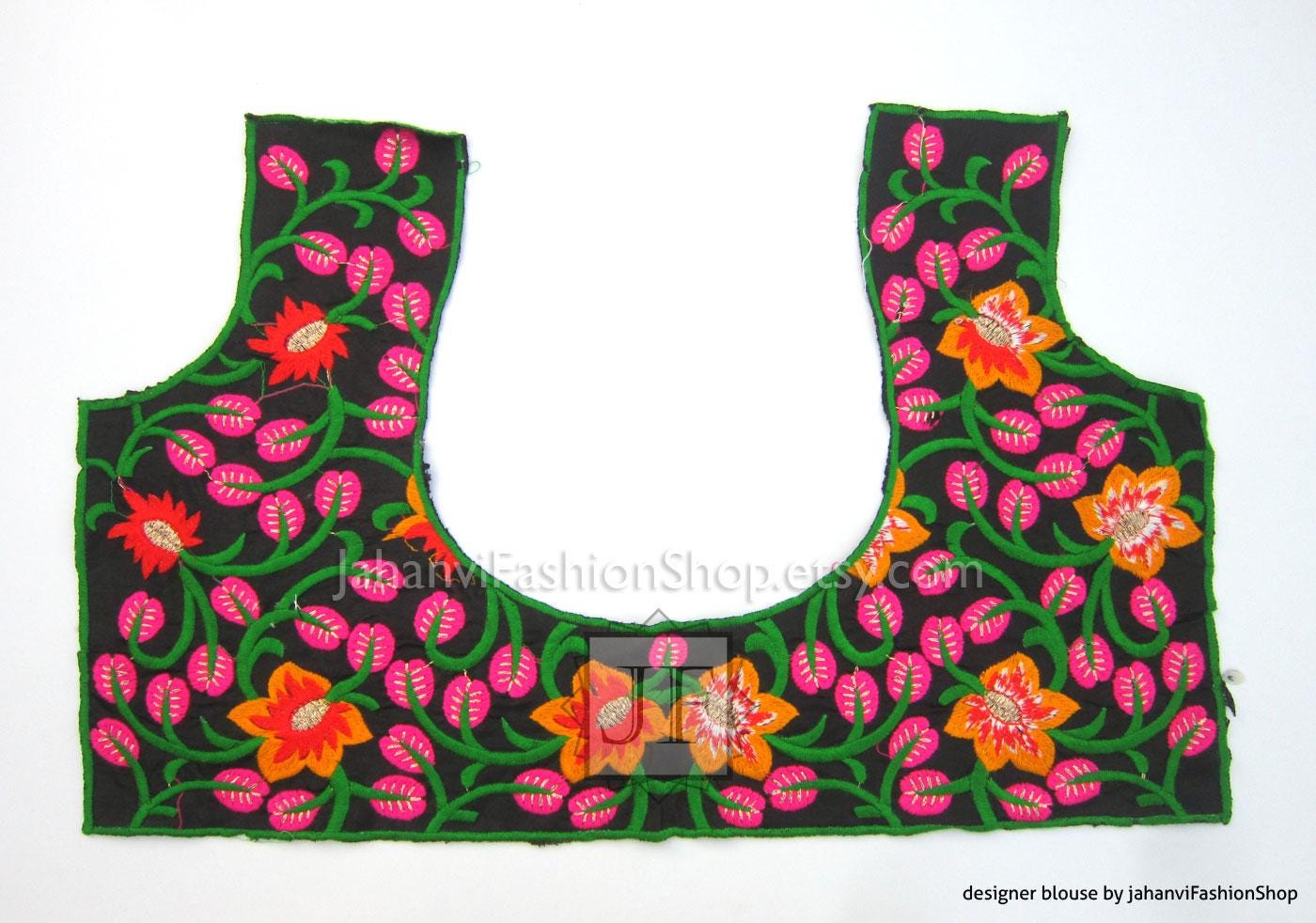 Black sleeveless blouse with bright pink leaf vines and orange flowers, scooped neckline