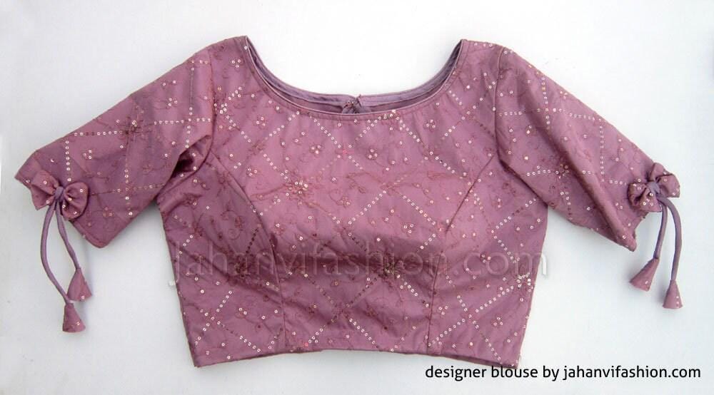 Mauve embroidered boat-neck blouse with puff sleeves and bow ties at cuffs