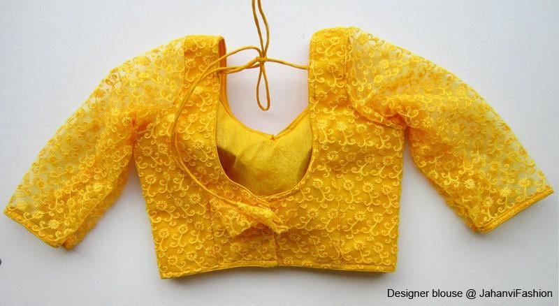 Gold embroidered saree blouse with round neckline and 3/4 net sleeves, lace-up back