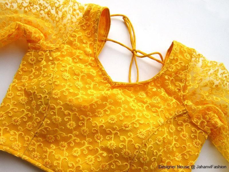 Gold embroidered saree blouse with 3/4 net sleeves and round neckline, lace-up back detail