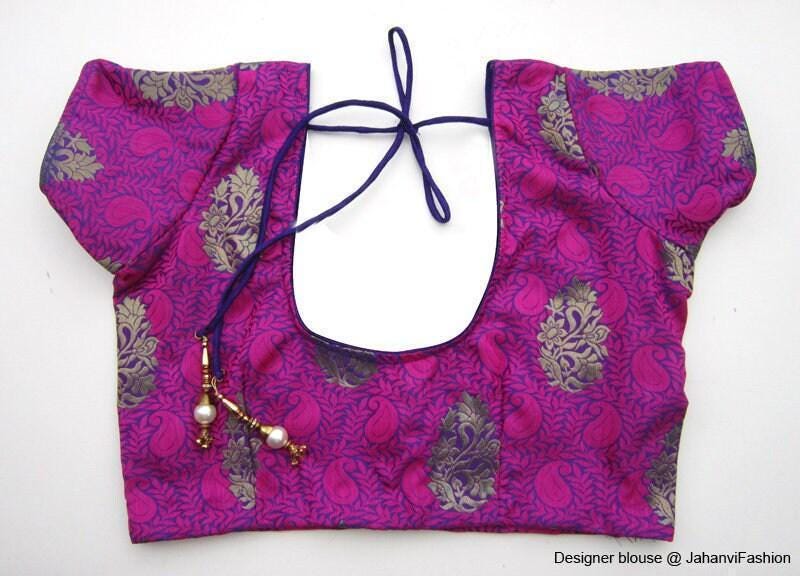 Magenta round-neck crop blouse with short cap sleeves and back tie; brocade motif panels