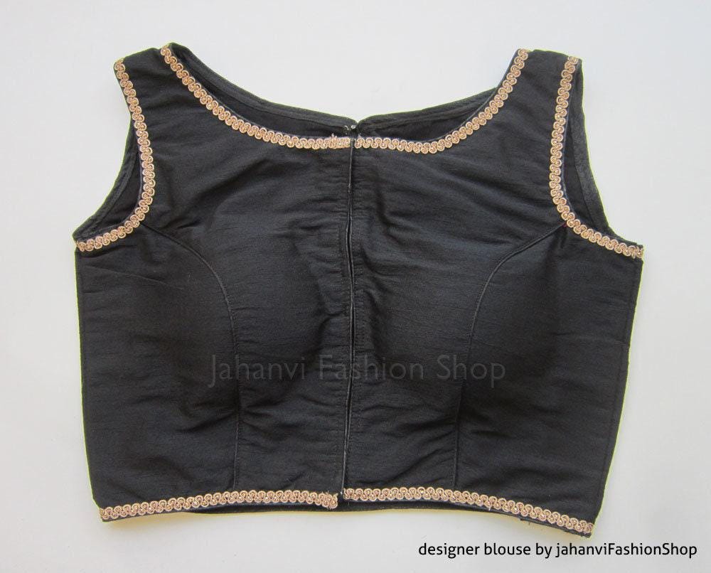 Black saree blouse with boat neckline and gold trim, sleeveless front button placket