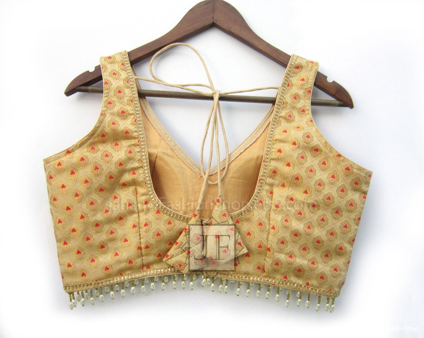 Cream-gold brocade blouse, back with V-neck tie strings and tassel fringe hem
