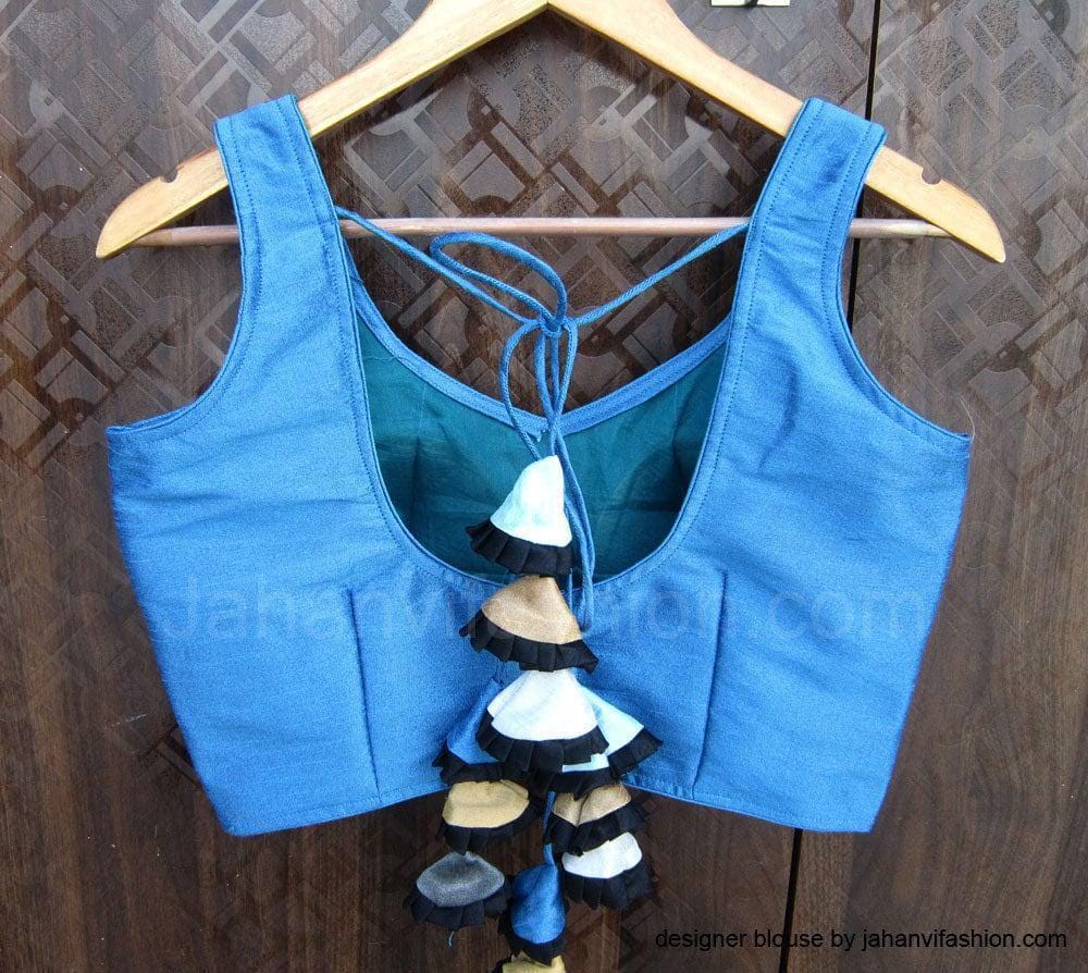 Blue sleeveless saree blouse with open back and tassel detail, plus-size style