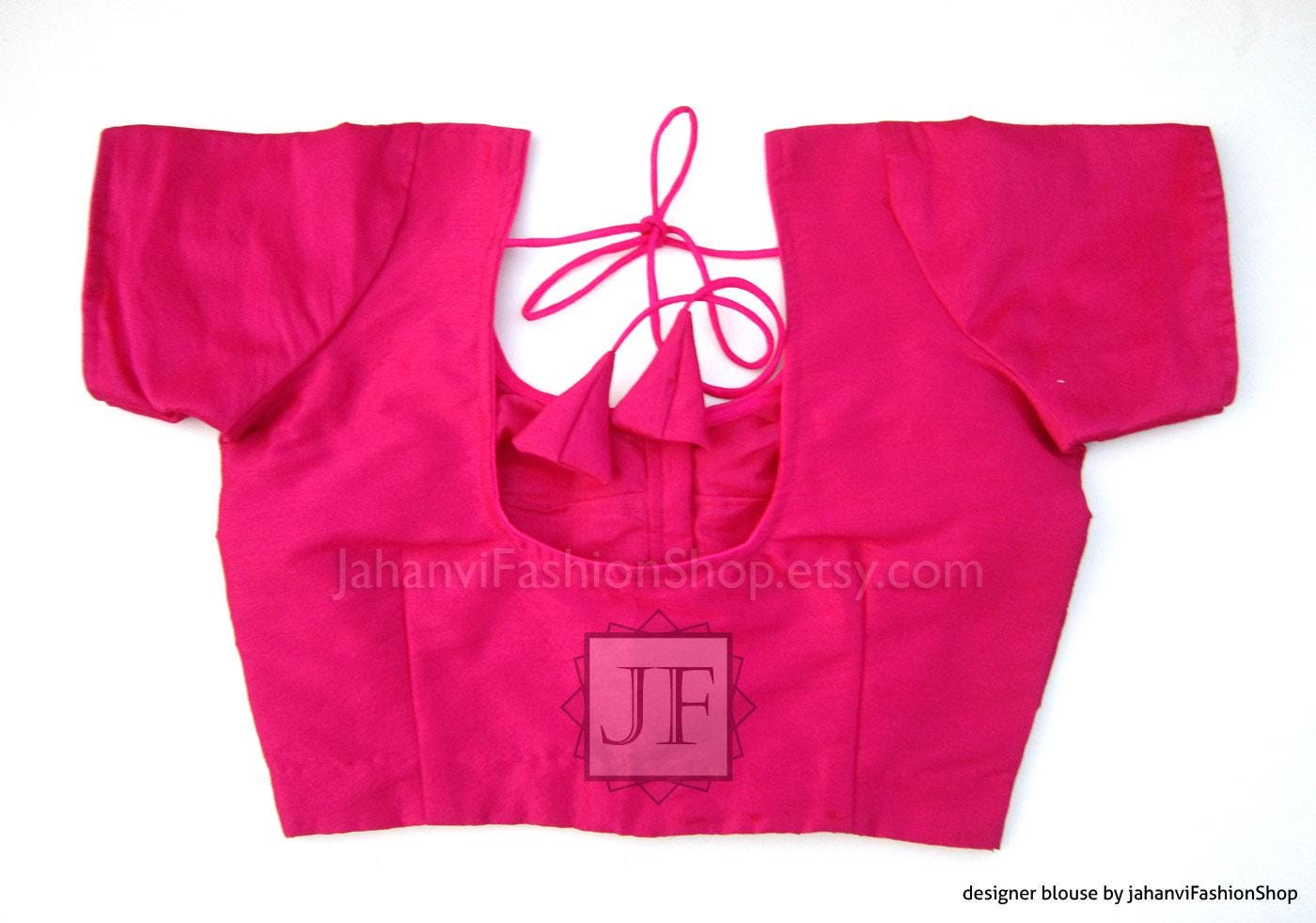 Round-neck saree blouse in bright magenta pink, short sleeves, lace-up back