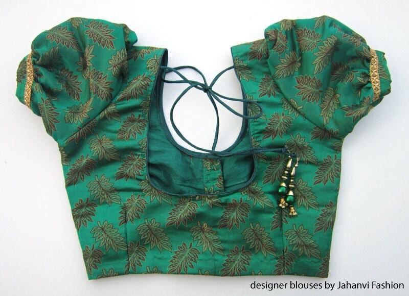 Green printed puff-sleeve saree blouse front with hook, tie-back cords, frill cuffs