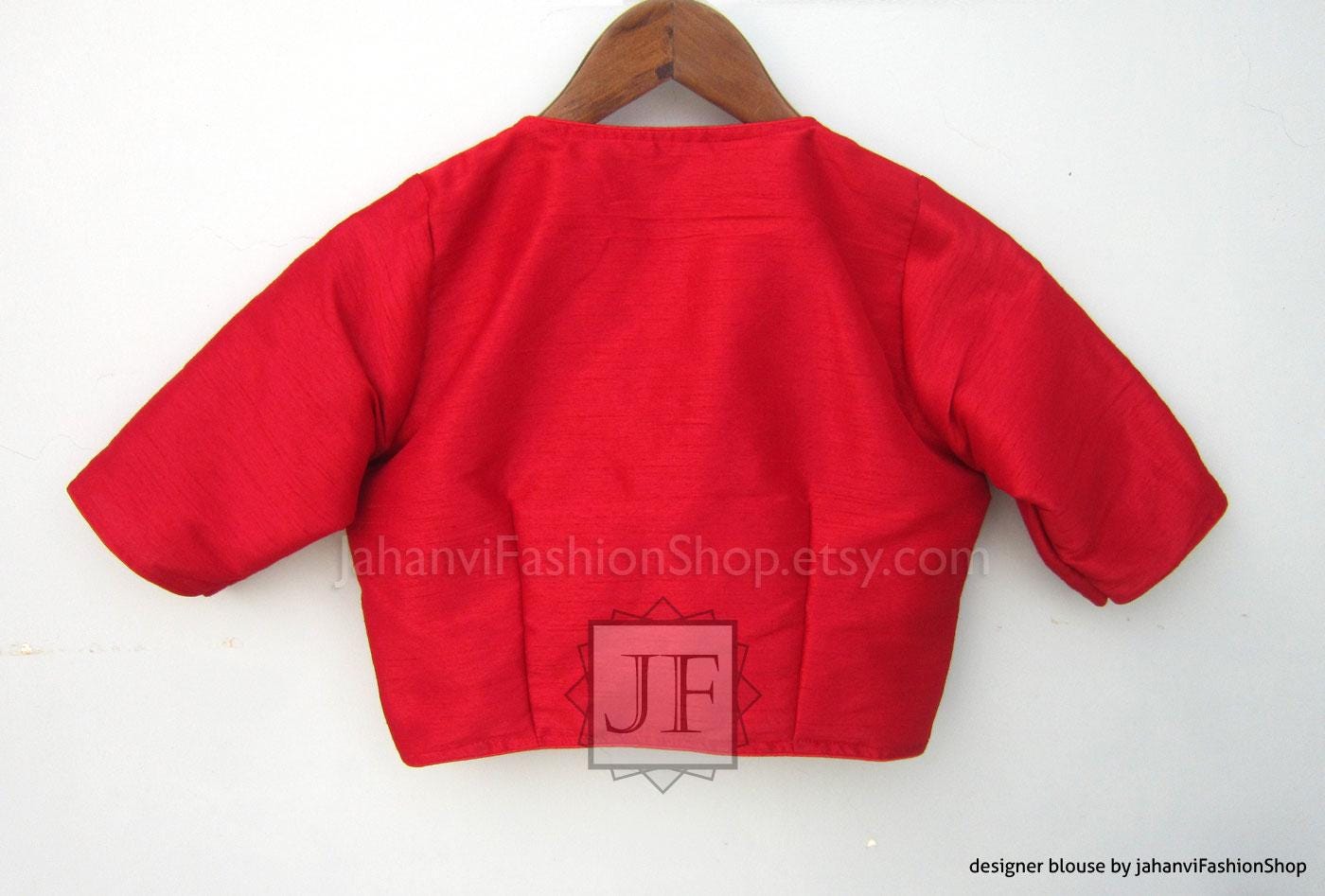 Red V-neck saree blouse back view with short sleeves and waist-length hem