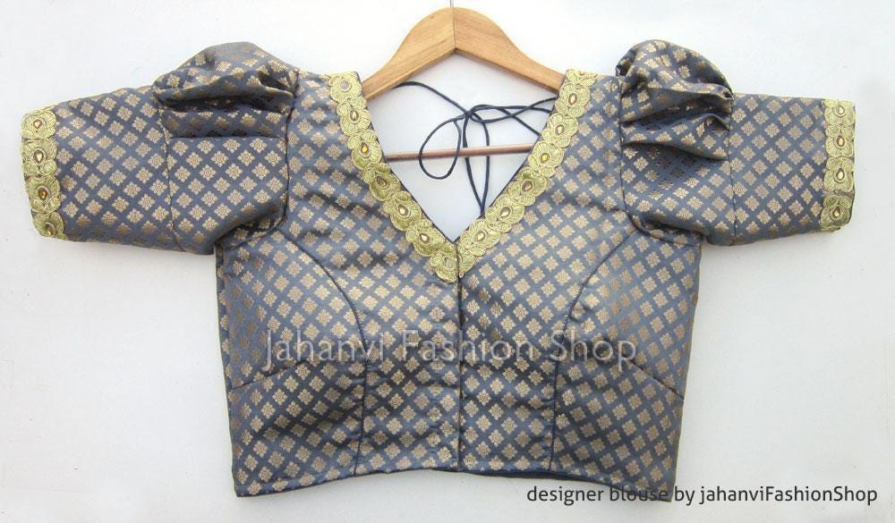 Sky blue saree blouse with puff sleeves, V-neck and scalloped gold trim, back tie