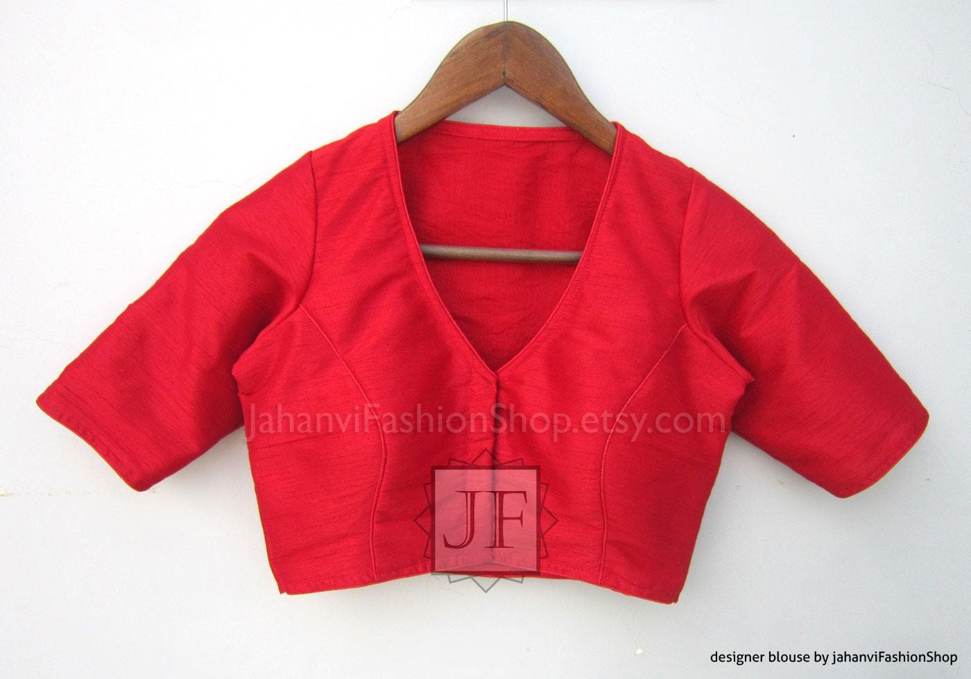 Red V-neck saree blouse with short sleeves and wrap-style front panel
