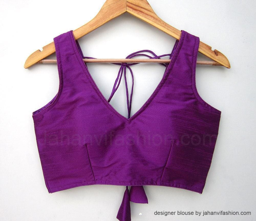 Purple sleeveless saree blouse with deep V-neck and back tie strings