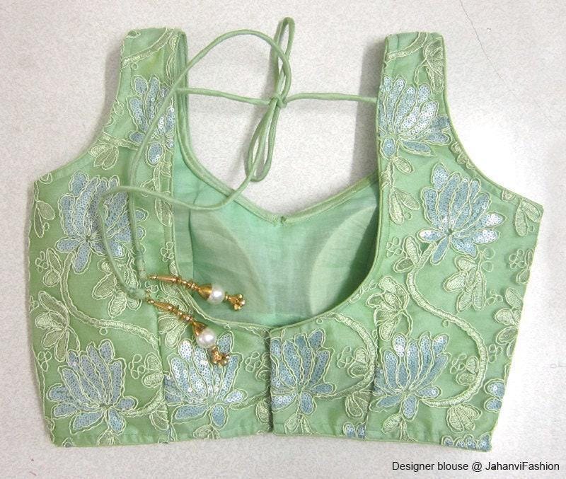 Mint green embroidered saree blouse with sweetheart neckline and bead detail